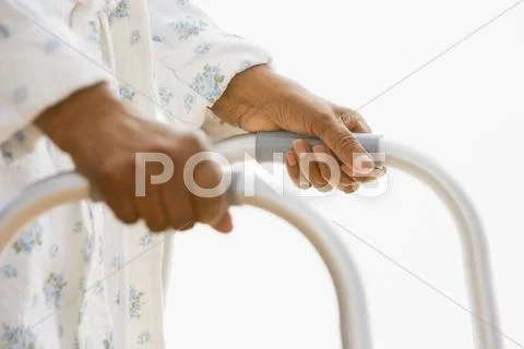 Close up of senior African woman using walker Stock Photos