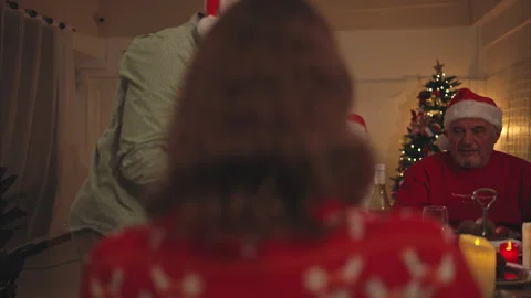 Close-up of senior couple while my son was chopping up a roast turkey Stock Footage 254168540