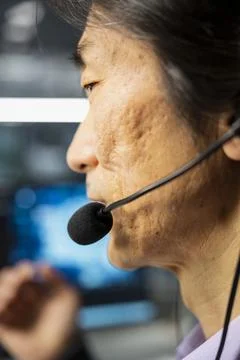 Close up of senior engineer doing tech support in server hub Stock Photos