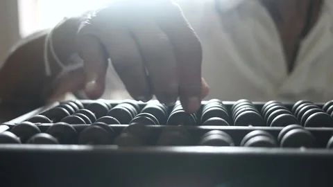 Close up of senior hand using chinese abacus or old antique calculator on table Stock Footage 138080042