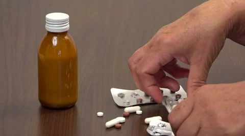 Close up to senior hands sorting medications  Stock Footage 46216600