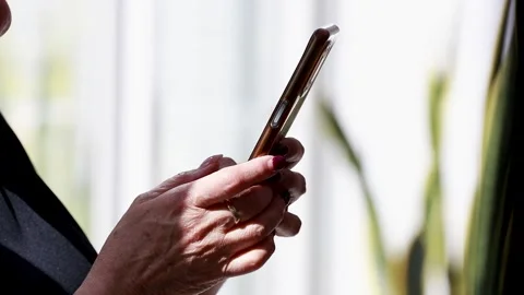 Close-up of senior hands using mobile phone Stock Footage 347170615
