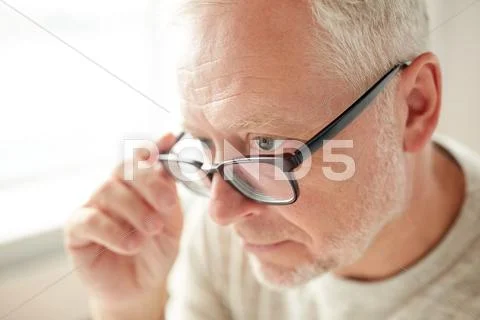 Close up of senior man in glasses looking Stock Photos