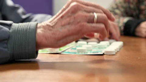 Close up of a senior man playing bingo at Nursing home. leisure game, support Stock Footage 244466877