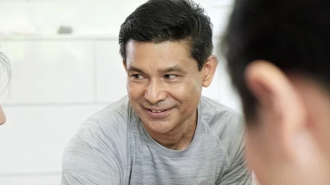 Close up of senior man talking to his young friends. Stock Footage 107854361