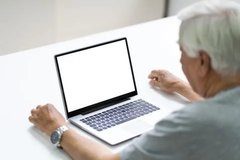 Close-up Of Senior Man Using Laptop Showing Blank Screen Stock Photos