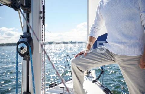 Close up of senior man on yacht sailing in sea Stock Photos