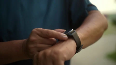 Close up of Senior old man using smart watch running at park. Grandfather. Stock Footage 274408450