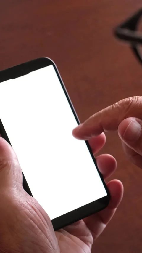 Close-up of a senior person's hands holding and using a mobile phone, swiping Stock Footage 344396304