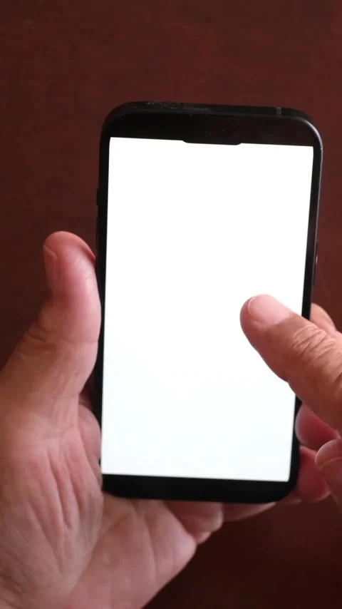 Close-up of a senior person's hands using a mobile phone with a white screen Stock Footage 344396352