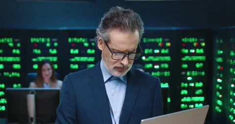 Close up of senior system administrator programmer in jacket and glasses looking Stock Footage 145292375