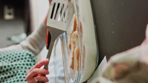 Close up of senior woman soaking bread with sweet milk and cinnamon with a spatu Stock Footage 264183373