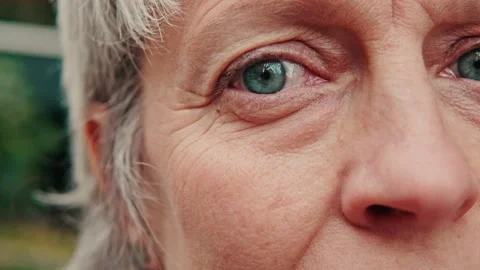 Close-Up of Senior Woman's Expressive Blue Eyes Stock Footage 314637871
