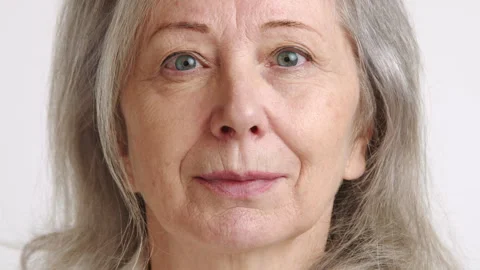 Close-Up of Senior Woman's Face Expressing Serenity and Experience Stock Footage 267197462