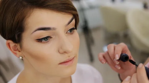 Close-up of separating and curling lashes process with mascara brush, beautiful Stock Footage 64516411