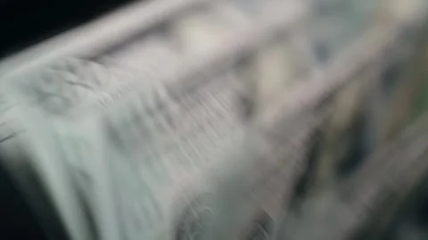 Close-up sequence of cash being counted, showcasing detailed textures of Stock Footage 333979052