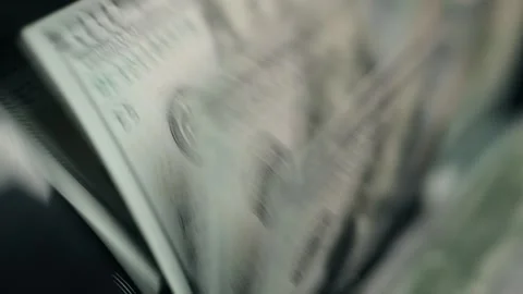 Close-up sequence of cash being printed, showcasing the intricate details of Stock Footage 331079827