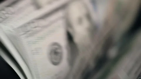 Close-up sequence of cash being processed through a banknote printing machine, Stock Footage 333978924