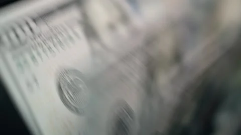 Close-up sequence of cash bills being counted, showcasing the texture and Stock Footage 331079910