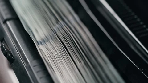 Close-up sequence of cash counting machine processing banknotes, showcasing the Stock Footage 333979111