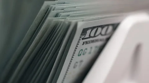 Close-up sequence of neatly stacked U.S. hundred-dollar bills in a cash drawer, Stock Footage 333979040
