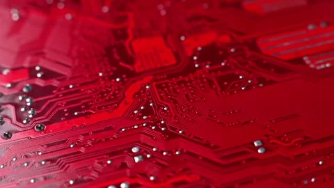 Close-up sequence of red circuit board showcasing intricate patterns, electronic Stock Footage 330485914
