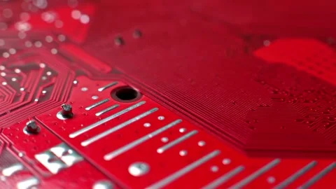 Close-up sequence of red circuit board showcasing intricate patterns, electronic Stock Footage 330486110