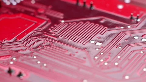 Close-up sequence of red circuit board showcasing intricate patterns, electronic Stock Footage 330486162