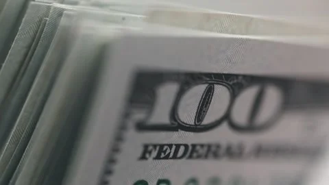 Close-up sequence of stacked hundred-dollar bills showcasing detailed textures Stock Footage 333979140