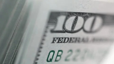 Close-up sequence of stacked hundred-dollar bills revealing intricate details of Stock Footage 333979145