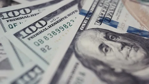 Close-up sequence of US dollar banknotes showcasing intricate details, including Stock Footage 327695391