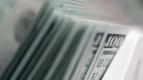 Close-up sequence of US dollar bills being organized in a cash drawer, Video stock 333979144