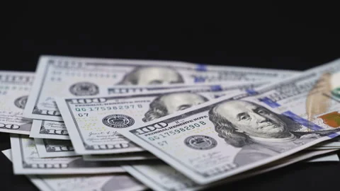 Close-up sequence of US hundred-dollar bills Stock Footage 328047378