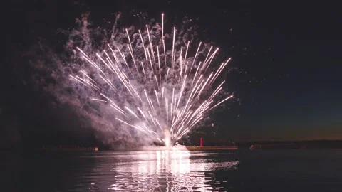 Close up sequential large fireworks bursting brightly in dark night sky Stock Footage 340632750