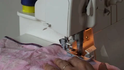 Close-up of Serger Overlock machine. Homemade edging cloth Stock Footage 138784837
