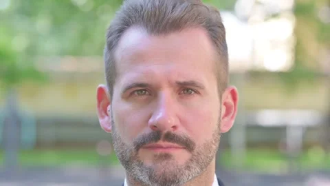 Close up of Serious Face of Middle Aged Businessman Stock Footage 287931974