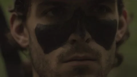 Close up of a serious hunter with facepaint on a hunt Stock-Footage 53644657
