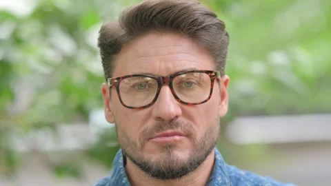 Close-up of a Serious Middle Aged Man Face 動画素材 311379480