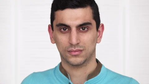 Close-up of a serious middle eastern young man's face Stock Footage 86383104