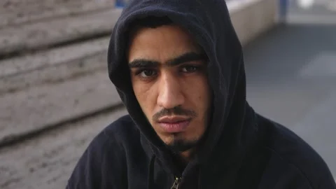 Close up on Serious young immigrant tunisian staring at camera Stock-Footage 218584586