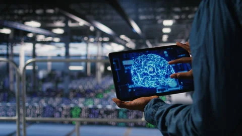 Close up of server farm admin using tablet to do AI automatization Video stock 310279004