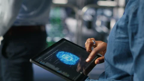 Close up of server farm admin using tablet to do AI automatization Video stock 310782664