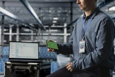 Close up of server farm developer using mockup phone, watching short clips Stock Photos