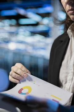 Close up of server farm specialist reading benchmark report files Stock Photos