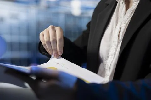 Close up of server farm specialist reading benchmark report files Stock Photos