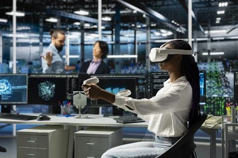 Close up of server farm worker typing on PC keyboard, deploying deep learning 写真素材