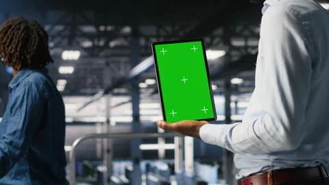 Close up of server hub admin using isolated screen tablet next to colleague Stock-Fotos