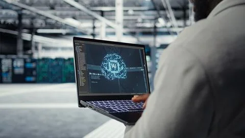 Close up of server hub admin using tablet to do infrastructure AI automatization Stock-Fotos