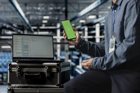 Close up of server hub computer scientist using chroma key mobile phone 스톡 사진