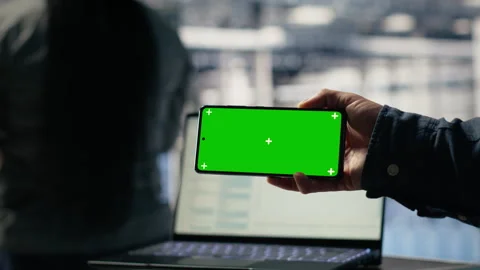 Close up of server hub programmer using mockup phone Stock Footage 314803066